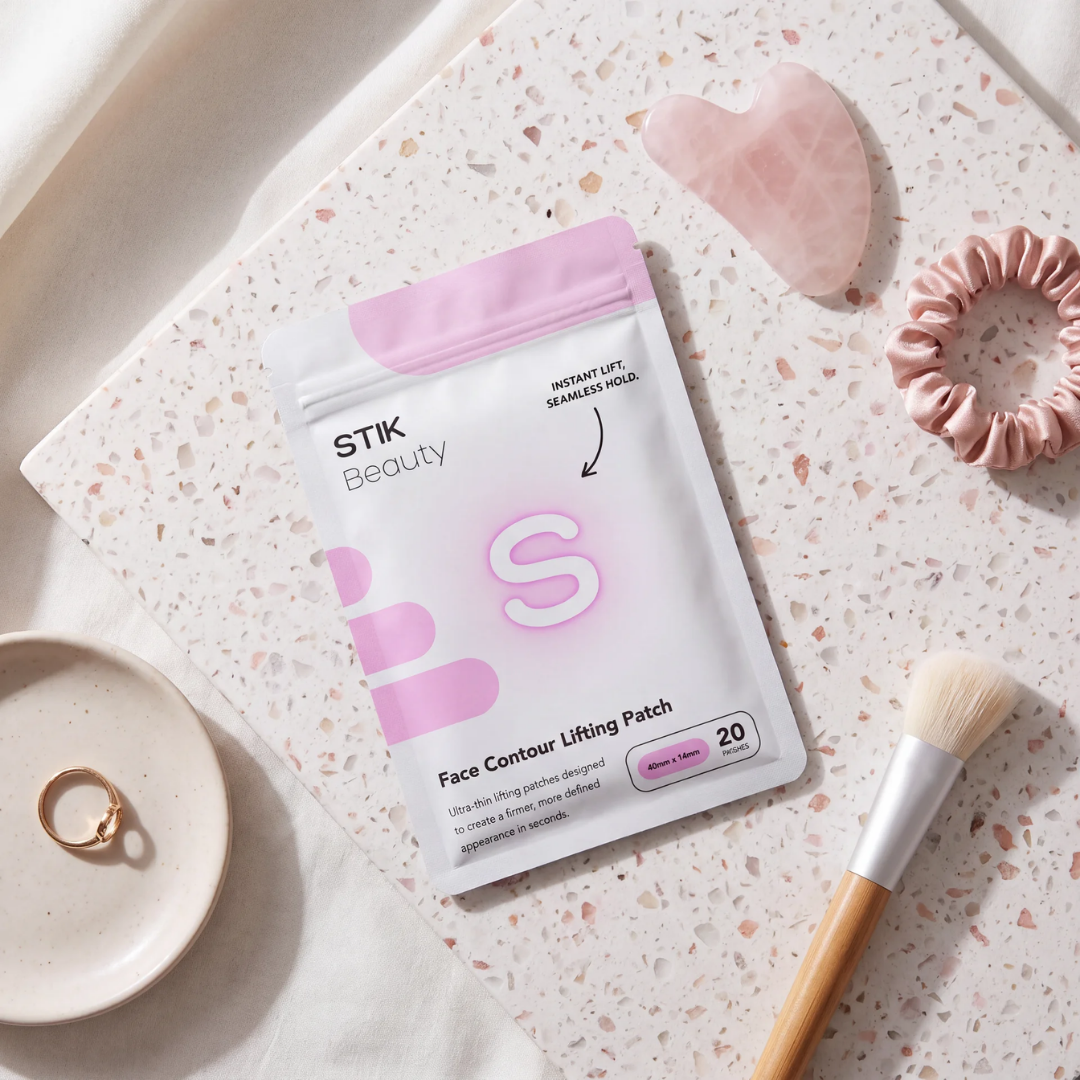 Face Contour Lifting Patch pouch flat lay with gua sha and brush